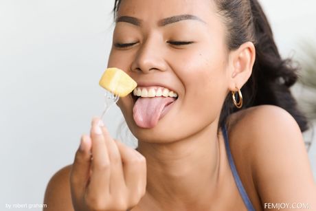 Asian teen Magen Thai removes her dress and displays her hot body