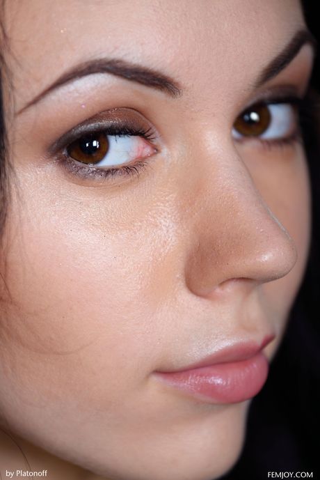 Hot russian girl Sheri Vi gets completely naked on a sofa without shyness