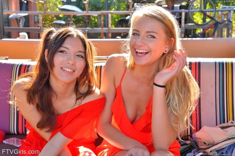 Lesbian teens Harley Jameson and Melody Wylde finger each other on a patio