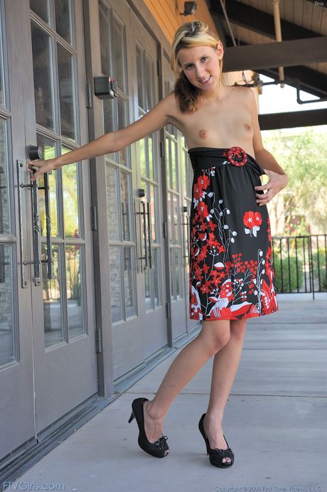 Alluring blonde teen Kiki gets naked before toying her pussy in a bedroom