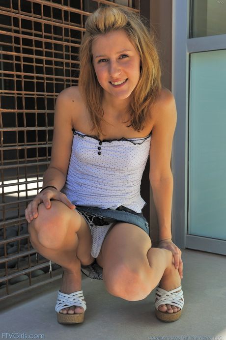 Cute covergirl Kiki gets naked before masturbating with a sex toy