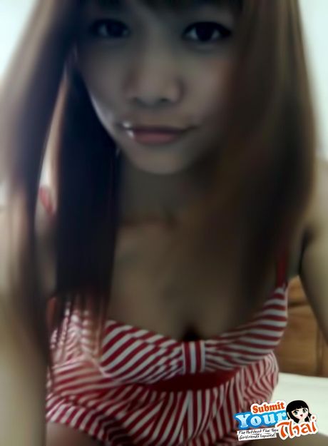Asian stunner Amateur Girl exhibits her huge tits and poses in a solo
