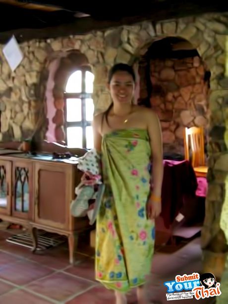 Brown-Eyed thai beauty Amateur Girl shows off her massive tits and poses in a solo