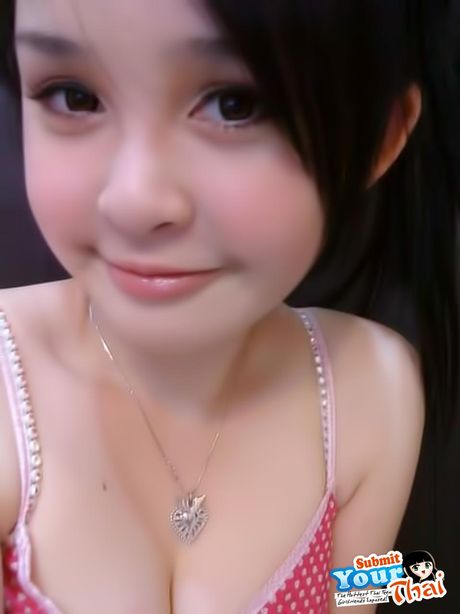 Brown-Eyed thai beauty Amateur Girl shows off her massive tits and poses in a solo