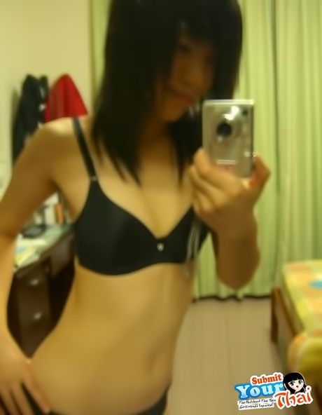 Brown-Eyed thai beauty Amateur Girl shows off her massive tits and poses in a solo