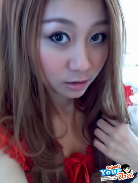 Brown-Eyed thai beauty Amateur Girl shows off her massive tits and poses in a solo