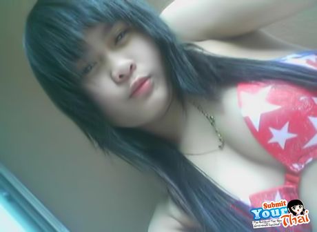 Brown-Eyed thai beauty Amateur Girl shows off her massive tits and poses in a solo