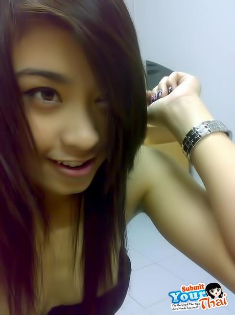 Angelic Asian babe Amateur Girl presents her amazing juggs and poses in a solo