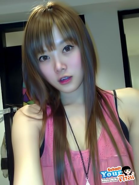 Brown-eyed Asian babe with a slim body goes naked for the camera in a solo