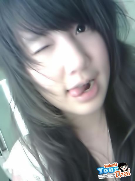 Asian beauty Amateur Girl reveals her petite tits and poses in a solo