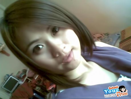 Asian covergirl Amateur Girl highlights her amazing melons and poses in a solo