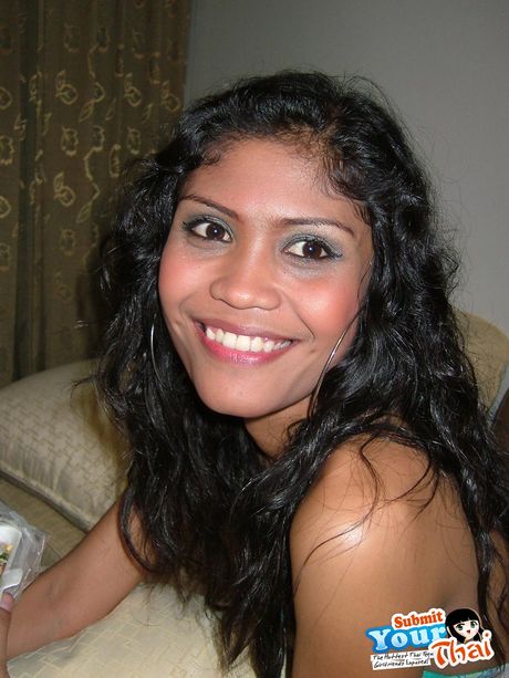 Black hair Amateur Girl displays her nice tits and poses in black stockings