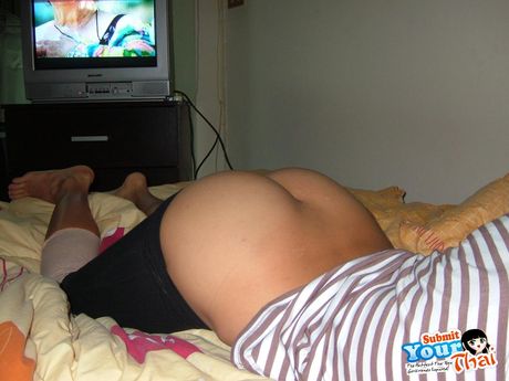 Black hair Amateur Girl displays her nice tits and poses in black stockings