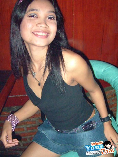 Brown-Eyed thai beauty Amber poses in a solo and highlights her amazing juggs