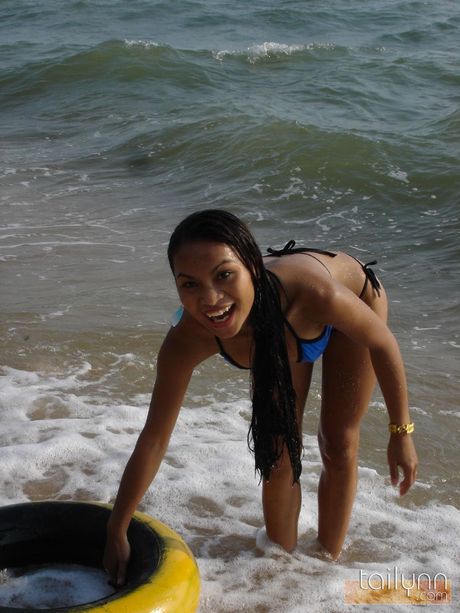 Asian amateur Tailynn reveals her tiny boobs and poses in a bikini