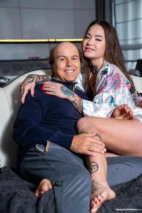 Tat-Covered russian brunette Jess Mori has sex with a man on a sofa