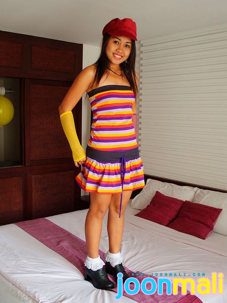 Asian girl Joon Mali highlights her petite tiny tits and poses in a solo show