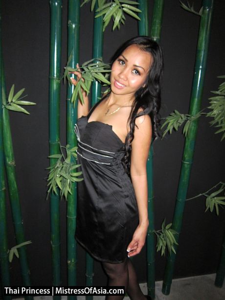 Asian girl Thai Princess shows her huge ass and poses in stockings