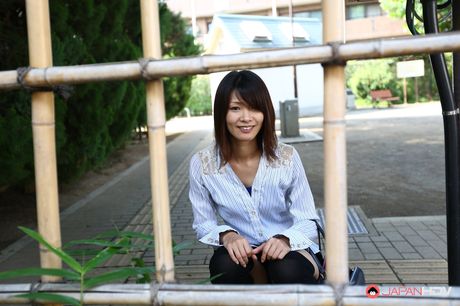 Asian beauty Yukari Sawada strips to her stockings and flaunts her natural tits