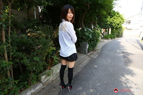 Asian beauty Yukari Sawada strips to her stockings and flaunts her natural tits