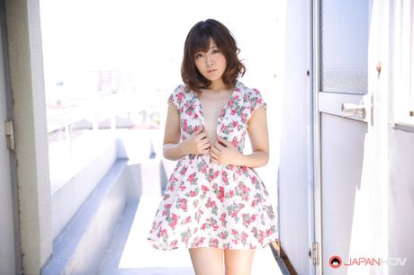 Brown-Eyed japanese chick with a slim figure shows off her undraped figure on the balcony