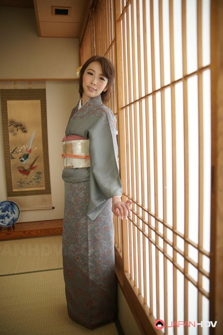 Angelic Asian Aya Kisaki presents her sexy ass and spreads her pussy in a solo