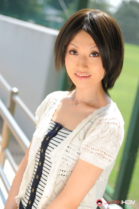 Asian girl Mitsuki gets naked on a blanket in a park before masturbating