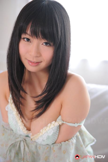 Sexy Asian babe Nozomi Hazuki reveals her massive tits and exhibits her nudity