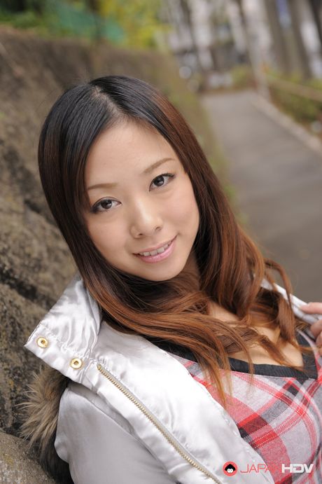 Asian beauty Asuka presents her large boobs and toys her pussy outdoors