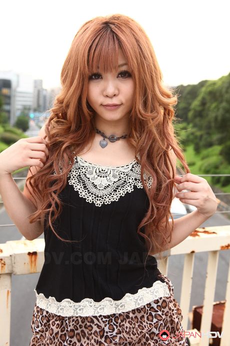 Attractive Asian teen Sarina Tsubaki strips and demonstrates her big tits outdoors