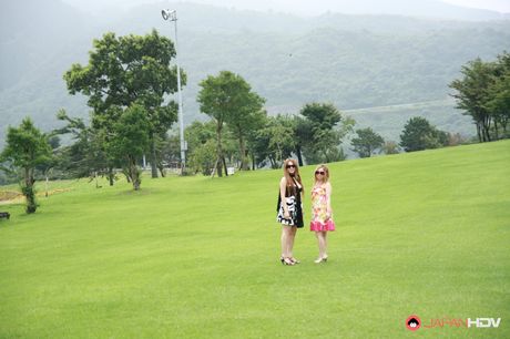 Light-haired covergirls in sunglasses get naked on a blanket in a field