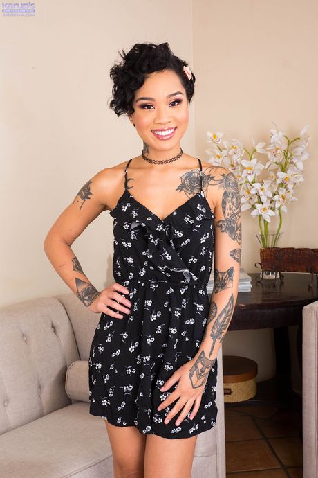 Asian teen Honey Gold removes her dress and captures her skyclad appearance in a solo