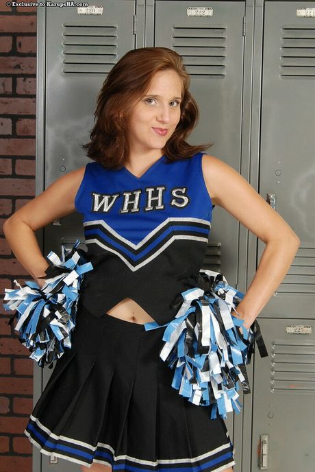 Cute cheerleader Courtney strips her uniform and shows her amazing melons