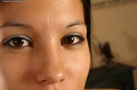 Dark-Haired cutie Candace displays her nice tits and bald pussy in the nude