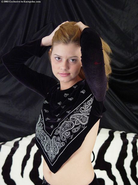 Stunning american blonde teen Jessica Cooper removes a black dress before toying her pussy