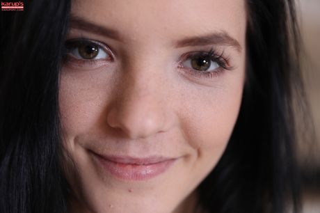 Dark haired teen Anie Darling removes a bra and panty set to get naked