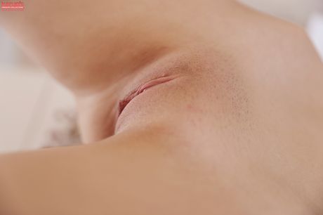 Dark haired teen Anie Darling removes a bra and panty set to get naked