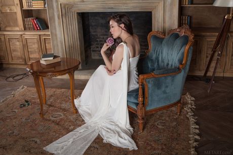 Striking russian stunner Ulia removes her dress and flaunts her hairy pussy