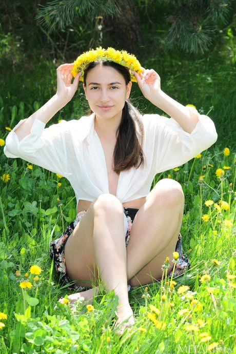 Russian belle Cira Nerri gets naked in a meadow and shows her tiny tits & ass