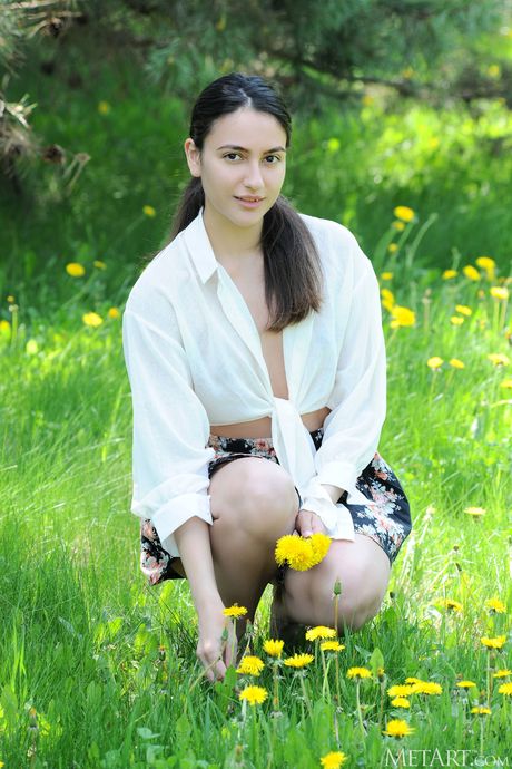 Tender teen Cira Nerri gets naked in a field of wildflowers