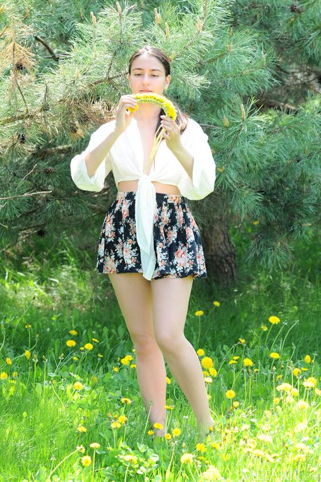 Tender teen Cira Nerri gets naked in a field of wildflowers