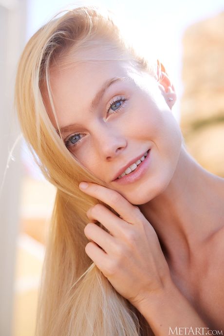 Blond ukrainian girl Nancy A gets completely naked on a patio chair