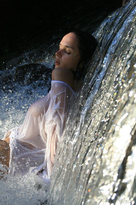 Ukrainian erotic model Jenya D demonstrates her big tits and poses nude