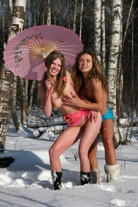 Hot lesbians Kelly A & Olesya A pose nude in a field of wildflowers