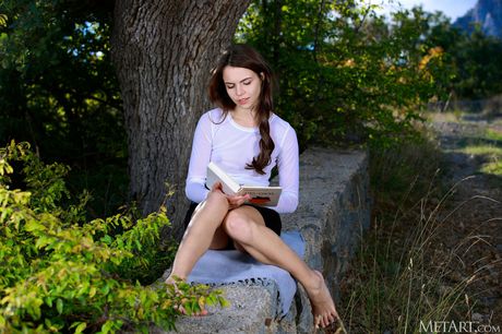 Hot russian babe Sirena Milano gets nude on a stone wall in a garden