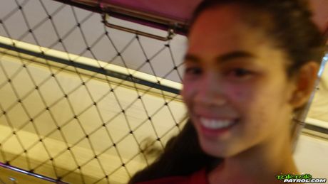 Asian babe Mee displays her hairy pussy and poses in a red dress