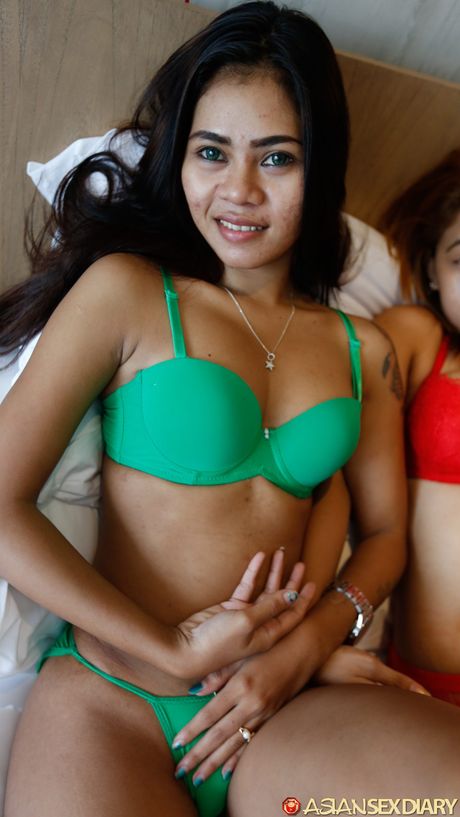 Teen teens Nurin and Siti get naked before a threesome on a bed