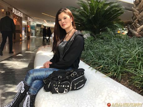 Asian doll Miyuki Son gets naked on a bed before a finger fuck