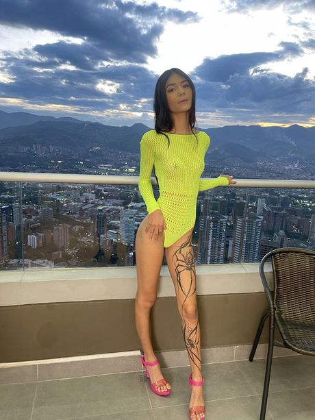 Dark haired teen Jana Red takes off her lingerie before a nude modelling gig