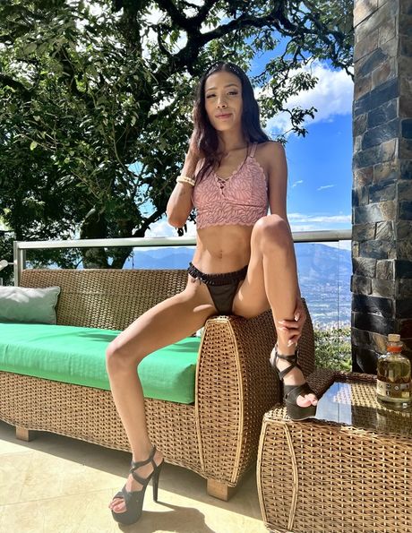 Hot colombian girl Megan Petite highlights her massive booty and rubs her pussy outdoors